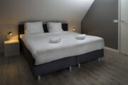 Slaapkamer in het vakantiehuis in Ouddorp