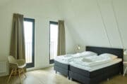 Slaapkamer in het vakantiehuis aan het Lauwersmeer